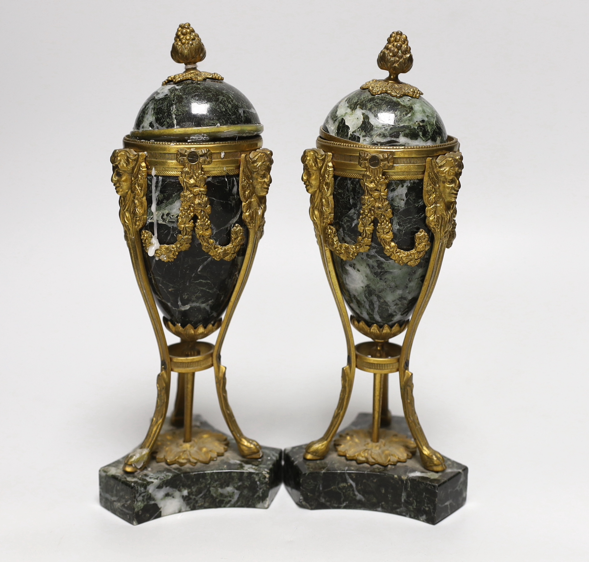 A pair of Regency style green marble and gilt metal cassolettes, decorated with bows and swags, each 24cm high